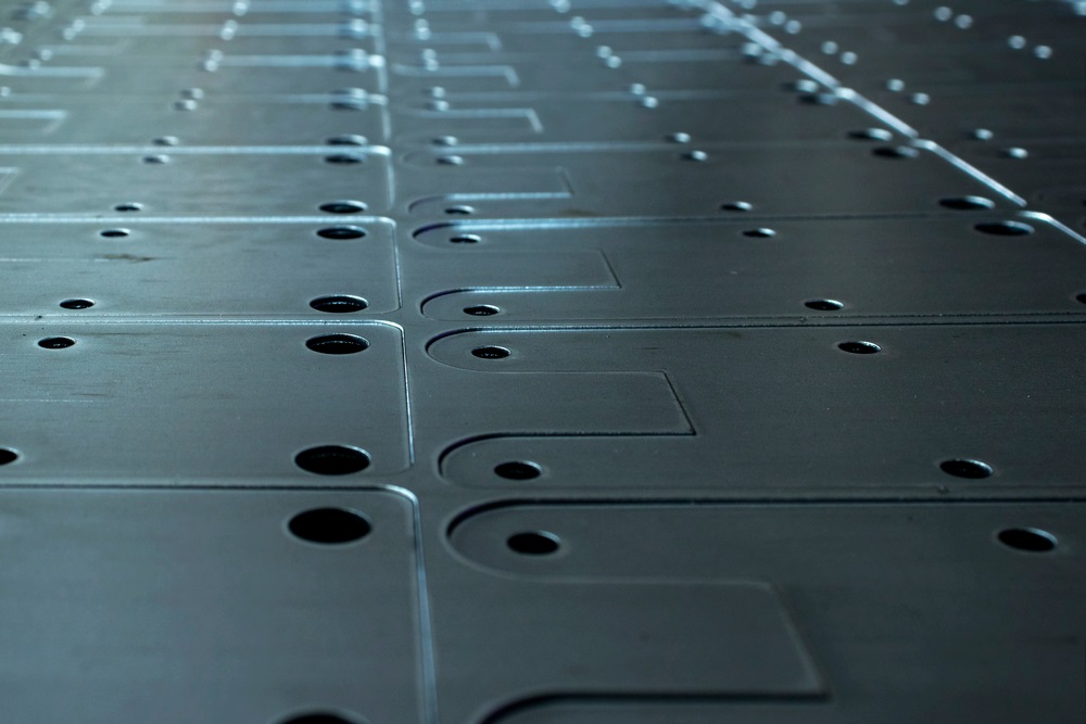 Nested sheet metal parts produced by laser cutting