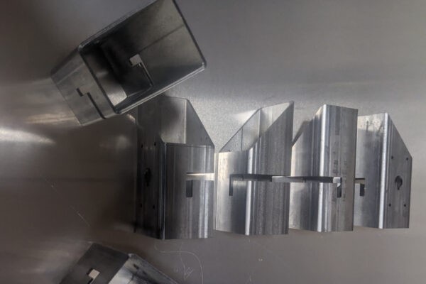 Tube components with laser-cut slots, miters and end profiles produced by Seaborn Manufacturing